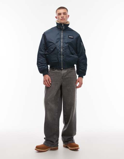 Schott logo patch zip pocket detail cropped padded buckle jacket with faux fur collar in navy