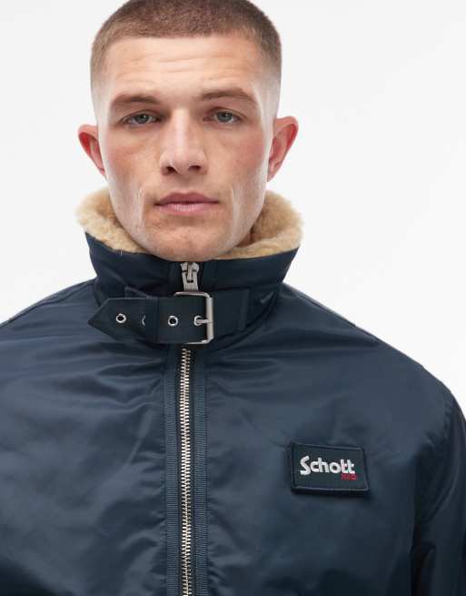 Schott logo patch zip pocket detail cropped padded buckle jacket with faux fur collar in navy