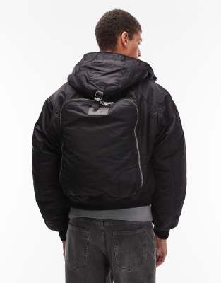 Schott Schott logo patch zip pocket detail cropped padded jacket with backpack detail in black