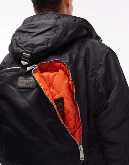 Schott logo patch zip pocket detail cropped padded jacket with