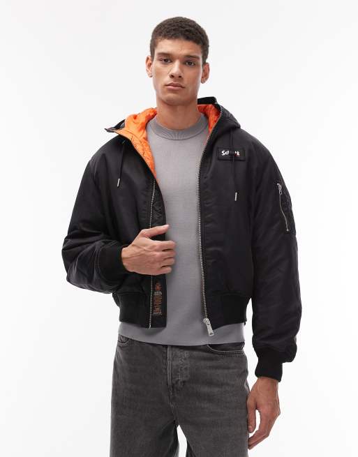 Schott logo patch zip pocket detail cropped padded jacket with