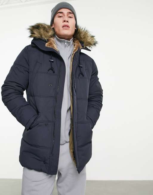 Schott Snorker faux fur hood quilted parka jacket in navy | ASOS