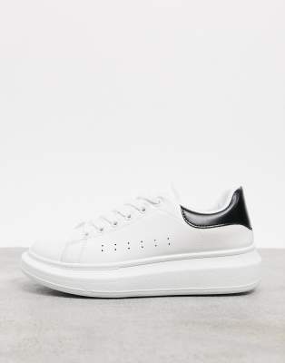 white trainers black back