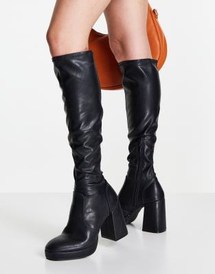 schuh Della platform knee boot in black stretch - ASOS Price Checker