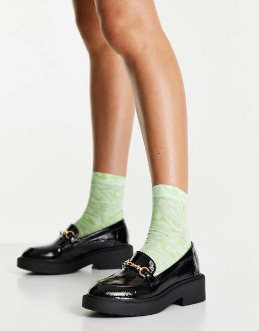 schuh - Lazarus - Platte loafers met plateauzool en gouden afwerking in zwart