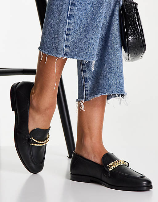 schuh Leandra leather loafers with gold chain trim in black