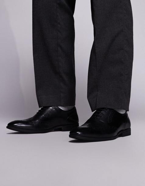 schuh - Row - Derby schoenen van leer met veters en brogue-detail in zwart - view 1