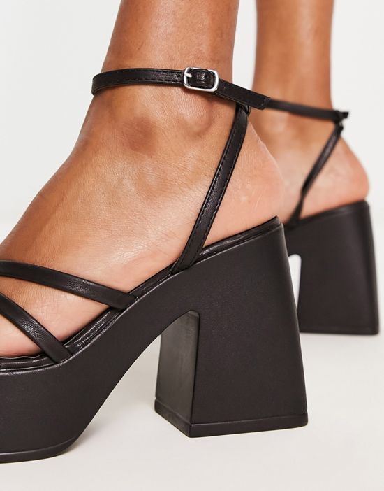 https://images.asos-media.com/products/schuh-sia-platform-heeled-sandals-in-black/203942577-3?$n_550w$&wid=550&fit=constrain