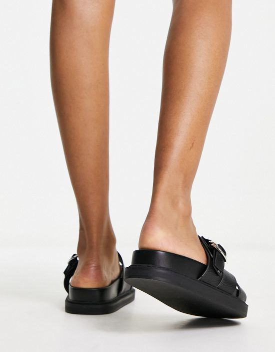 https://images.asos-media.com/products/schuh-tamara-cross-strap-flat-sandals-in-black/204307640-2?$n_550w$&wid=550&fit=constrain