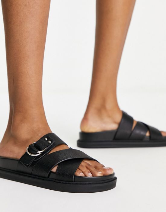https://images.asos-media.com/products/schuh-tamara-cross-strap-flat-sandals-in-black/204307640-4?$n_550w$&wid=550&fit=constrain