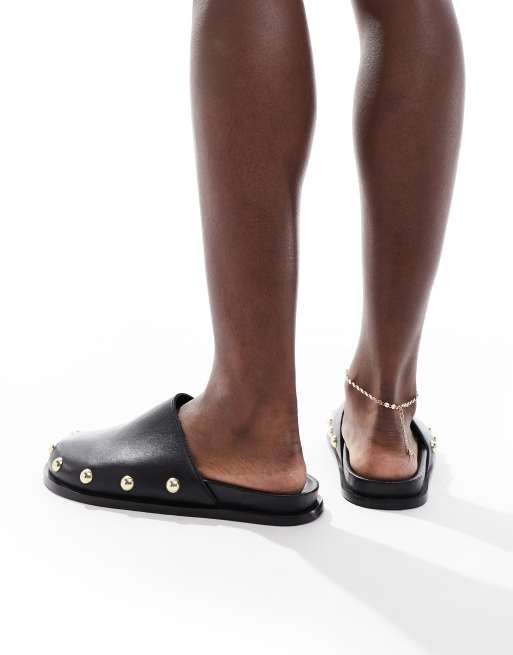 schuh Teale clog mules in black leather 