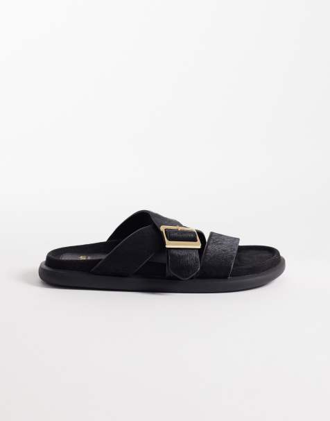 Schuh Tear cross over flat sandals with buckle detail in black pony - view 1