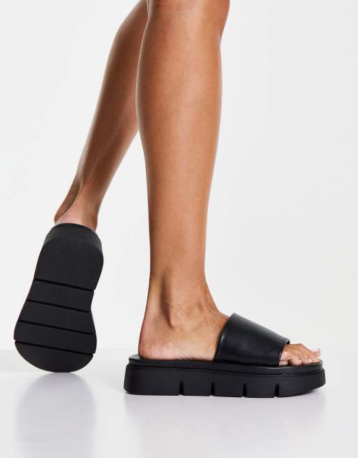 schuh Thurman chunky slides in black ASOS