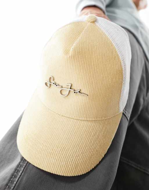 Sean John script logo baseball trucker cap in beige and white