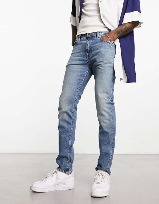 DTT rigid tapered fit ripped jeans in mid blue