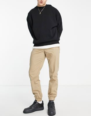 Selected Homme cotton blend slim fit cuffed chino joggers in tan  - TAN - ASOS Price Checker