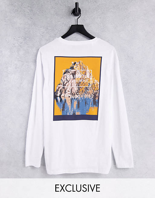 Selected Homme organic cotton long sleeve oversized fit t-shirt with retro cliff back print in white Exclusive to ASOS