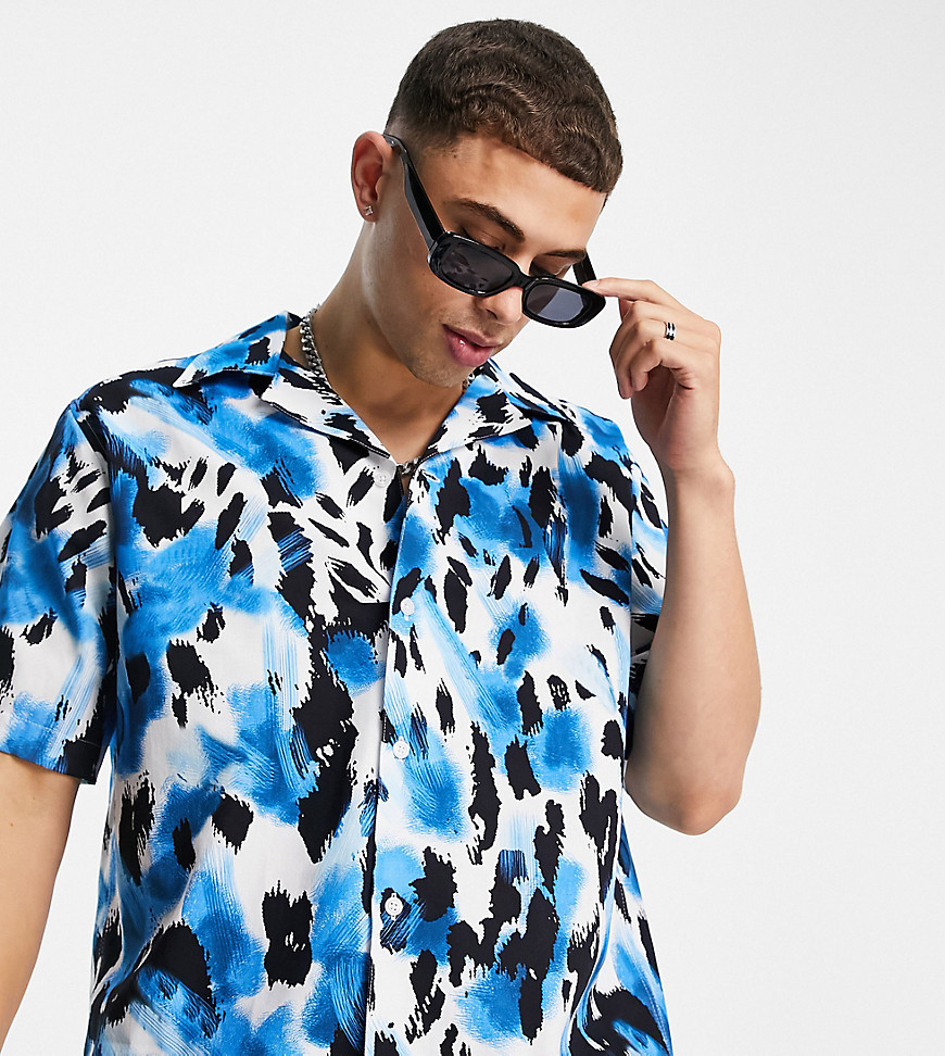 Selected Homme oversized shirt with revere collar in blue leopard print Exclusive at ASOS-Blues