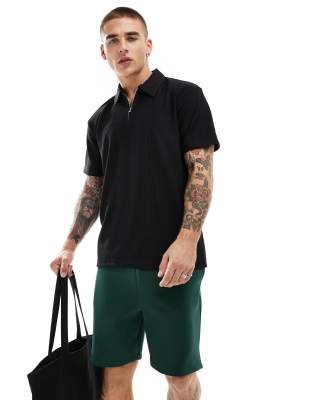 plisse zip polo in black