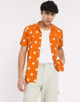 orange and white polka dot shirt