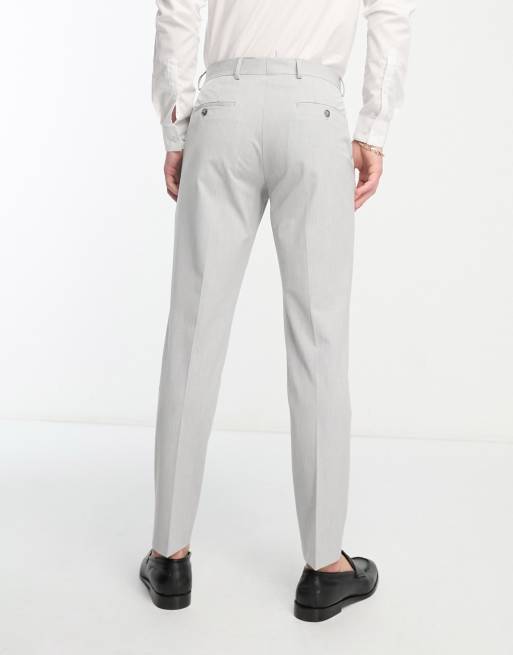 Light gray dress pants hand tailored in a fitted straight cut