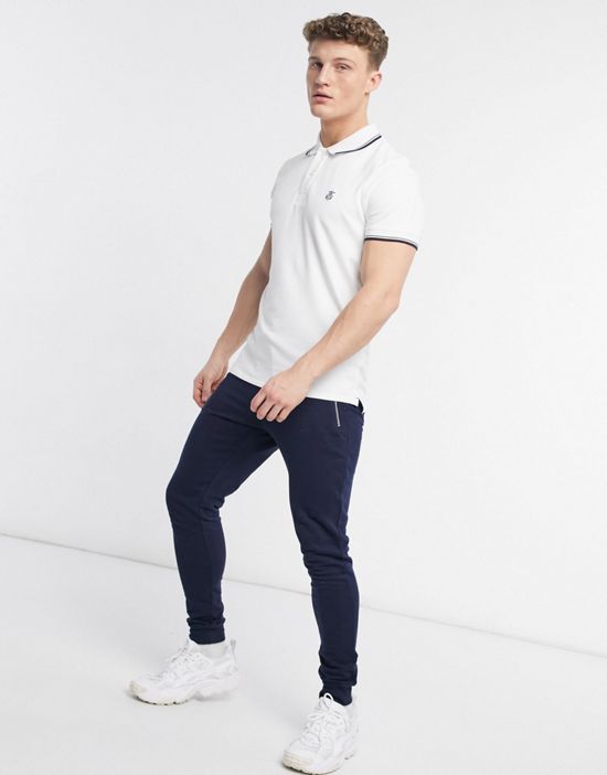 https://images.asos-media.com/products/selected-homme-tipped-polo-with-shield-logo-in-white/23380289-4?$n_550w$&wid=550&fit=constrain
