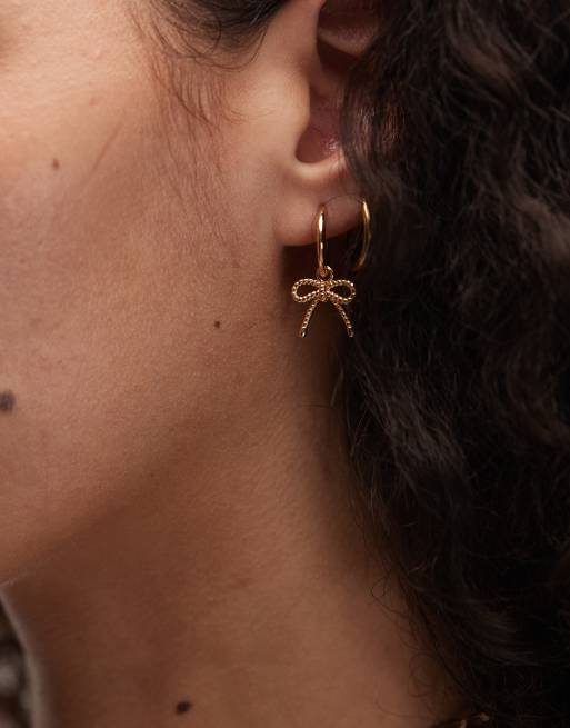 Seol + Gold bow huggie hoop earrings in 18kt gold vermeil