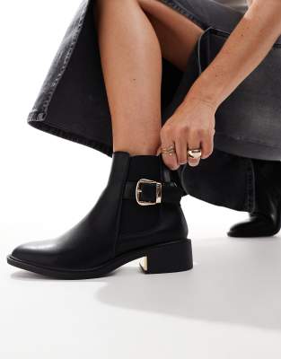 ankle boots with buckle details in black