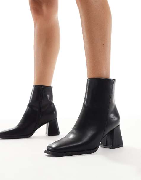 SEQWL block heeled mid ankle boots in black - view 1