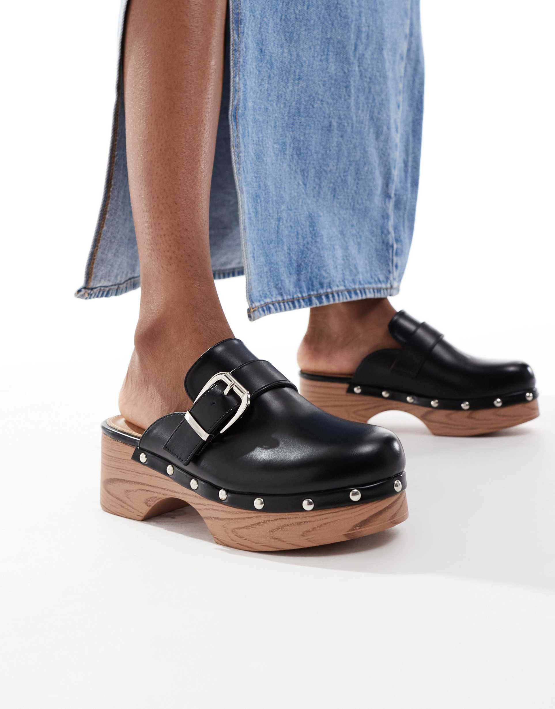 seqwl clog mules with buckles in black