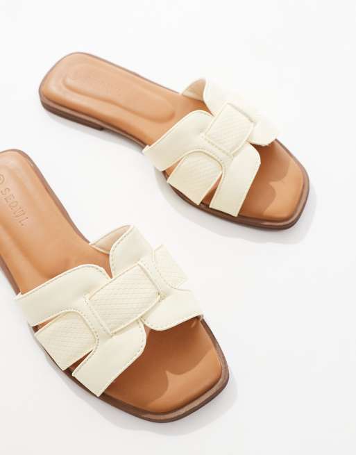 SEQWL flat sandals in pastel yellow faux leather