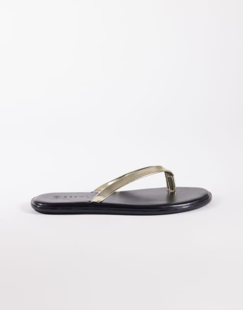 SEQWL jelly thongs in black with gold strap - view 1