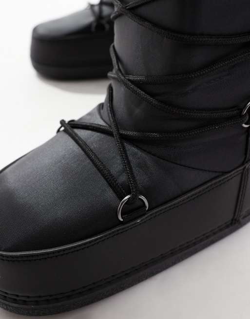 SEQWL knee high snow boots in black
