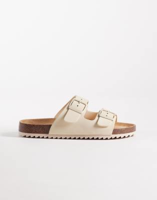 SEQWL - Olsen - Flache Sandalen in Cremeweiß mit zwei Schnallen