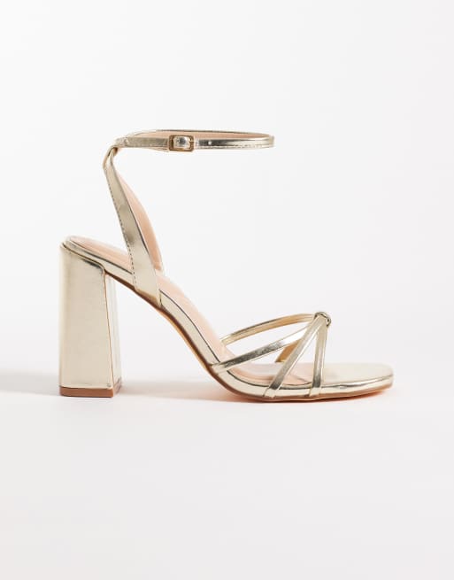 SEQWL - Sandali minimal con tacco largo e fascette sottili color oro