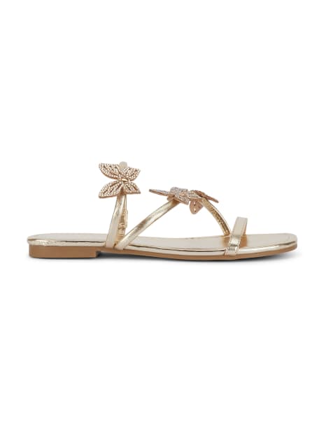 SEQWL Strappy sandals with rhinestone butterfly embellishments in gold - view 1