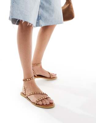 flat sandals with studded staps in tan-Brown