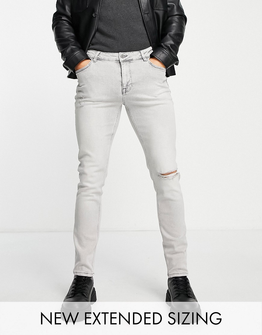 фото Серые зауженные джинсы со рваной коленкой asos design-серый