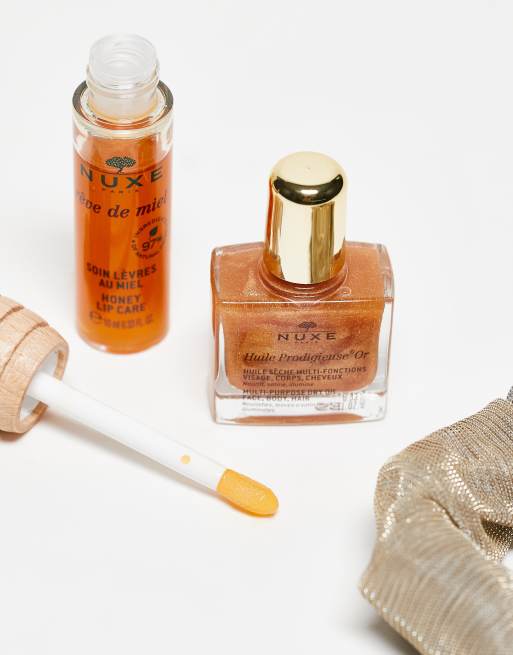 Set de productos Ready, Go, Glow con coletero abullonado gratuito Honey de NUXE, 3 de 4