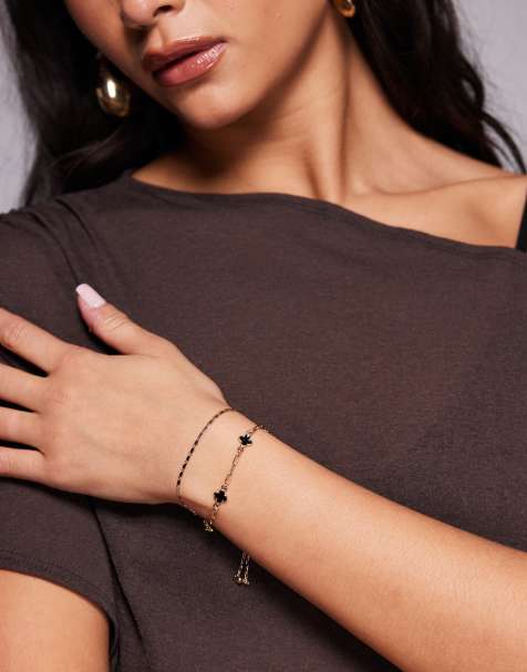 Set de pulseras doradas con tréboles negros Eloura de ALDO - view 1