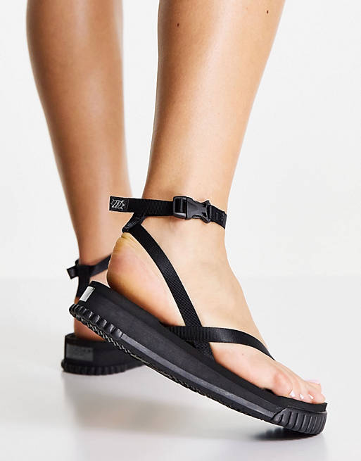 Shaka Buena Vista flat sandals with crossover strap in black