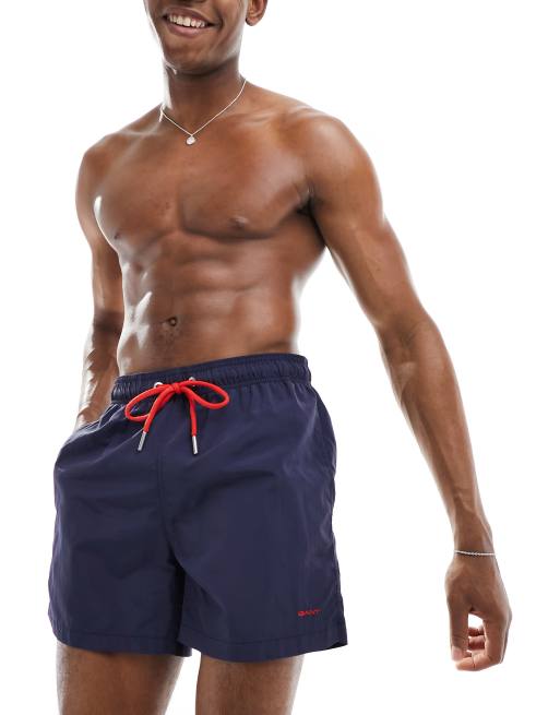 Shorts de baño azul marino con logo de escudo pequeño de GANT