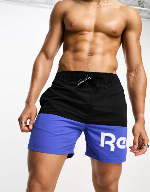 Shorts de baño azules y negros con diseño color block Deakin de Reebok