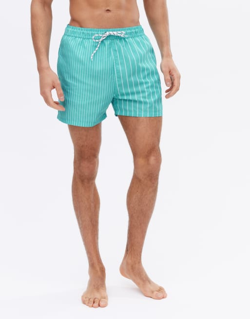 Shorts de baño color turquesa con diseño a rayas dividido de New Look
