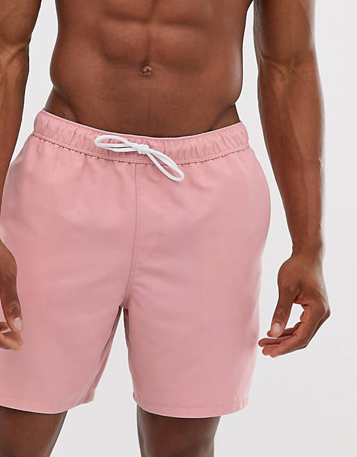 Shorts de baño con diseño de largo medio en rosa claro de ASOS DESIGN