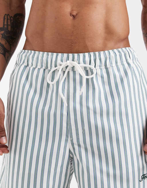 Shorts de baño cortos blancos a rayas verdes con bordados de ASOS DESIGN, 4 de 5