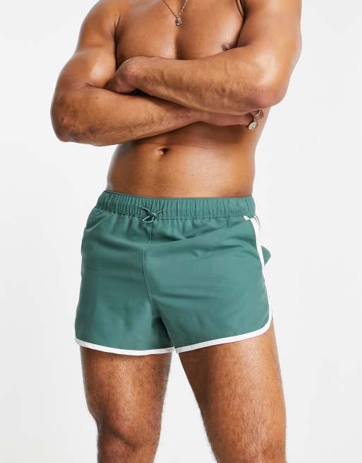 Shorts de baño cortos verdes de estilo deportivo con cordón ajustable y ribete en contraste de ASOS DESIGN