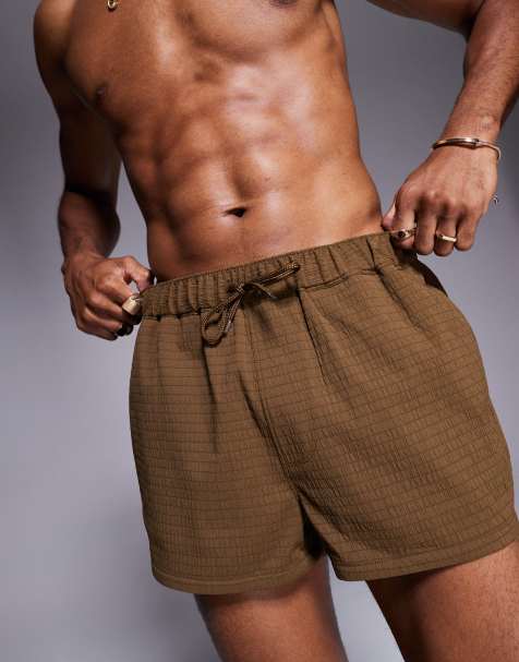 Shorts de baño muy cortos marrones de tejido texturizado de ASOS DESIGN - view 1