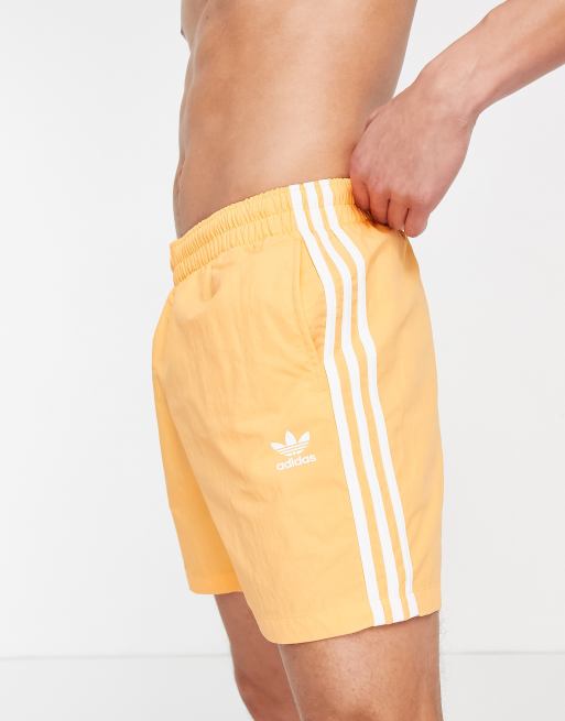 de baño naranjas con diseño de tres rayas adicolor de adidas Originals | ASOS