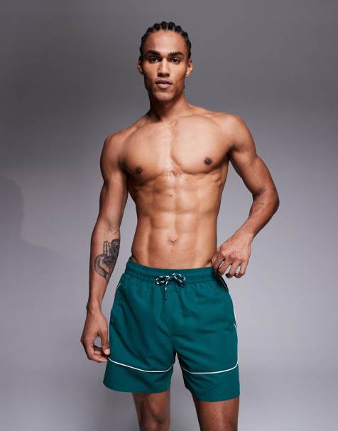Shorts de baño verde oscuro de largo medio con ribetes blancos en contraste de ASOS DESIGN - view 1
